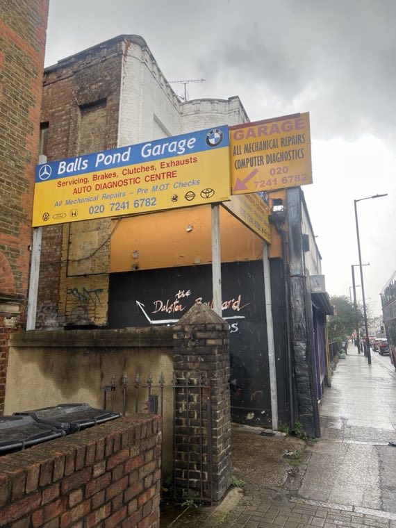 Balls Pond Garage forecourt sign listing servicing, brakes, clutches and exhausts